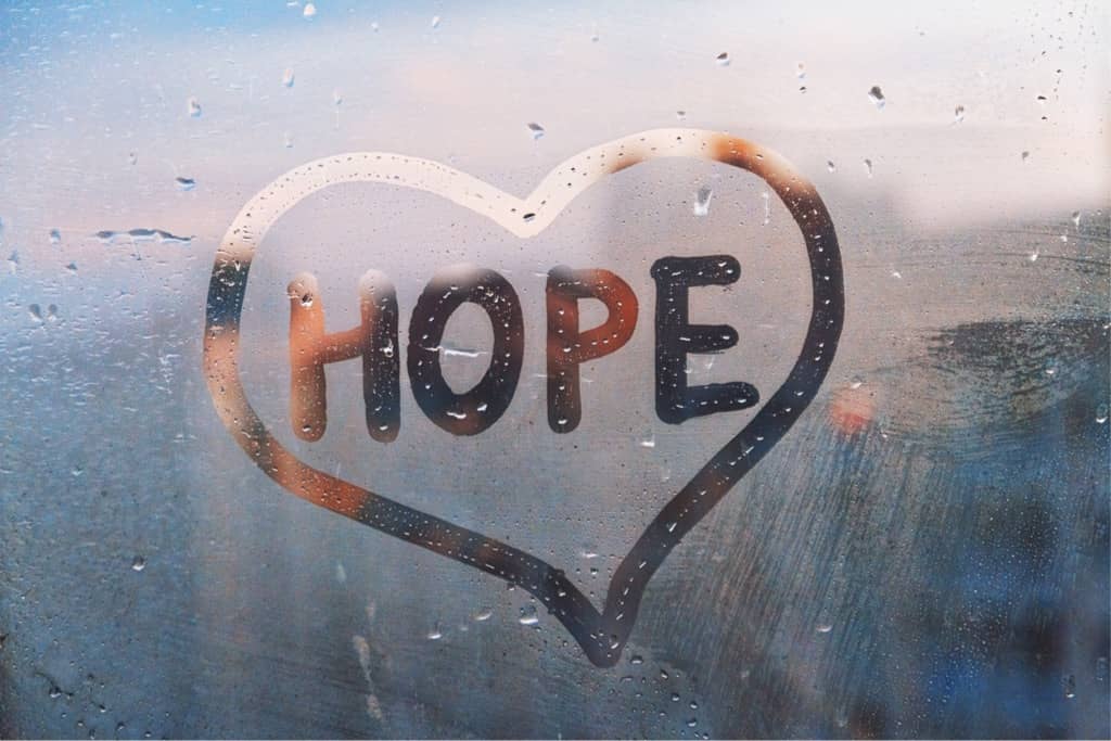 Heart drawn on a window with the word HOPE inside